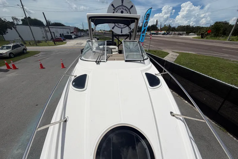 Slide: The Image of 2018 Regal 28 Express boat on display in a parking lot setting. - 51