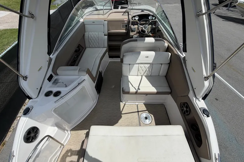 Slide: The Image of 2018 Regal 28 Express boat interior with seating and steering wheel. - 17