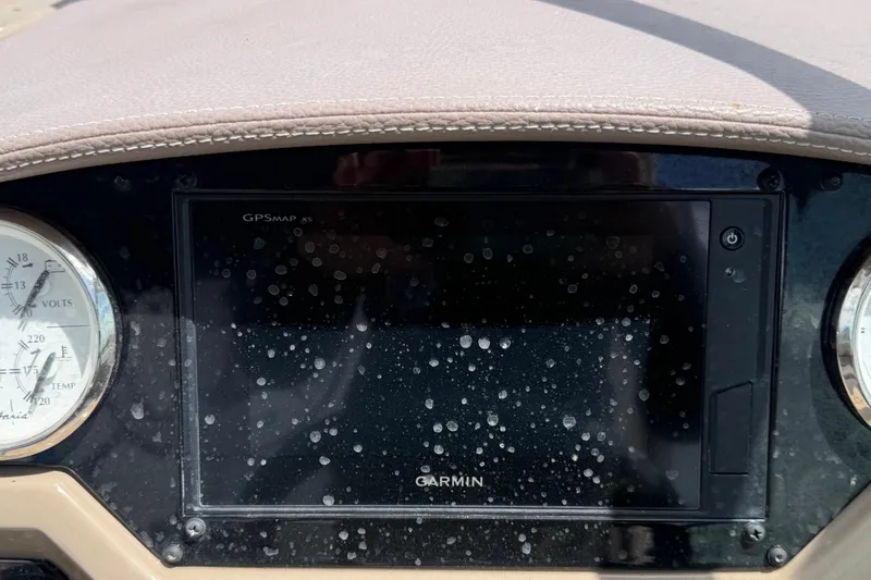 Slide: The Image of Dashboard of a 2018 Regal 28 Express boat with Garmin GPSMAP display. - 35