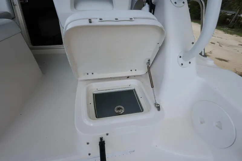 Slide: The Image of Open storage compartment on 2018 Robalo R305 Walkaround boat deck. - 18