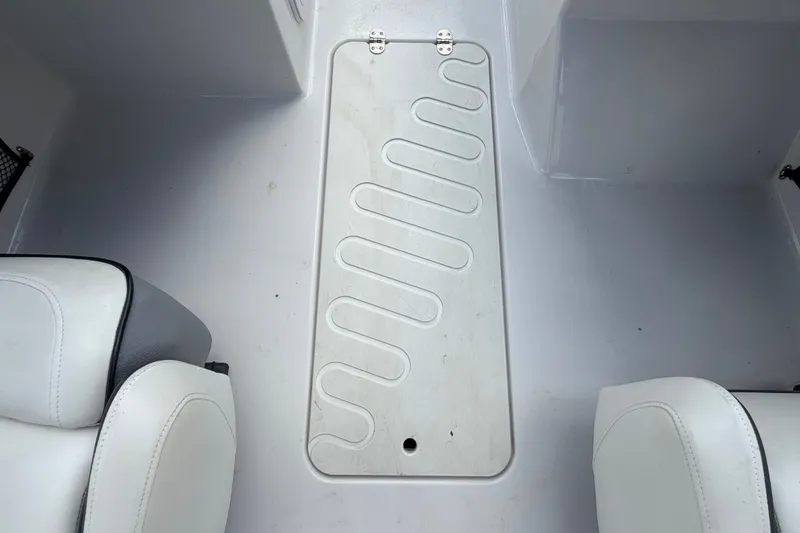 Slide: The Image of Interior view of a 2018 Scarab 195 G boat with white seating and floor panel. - 17