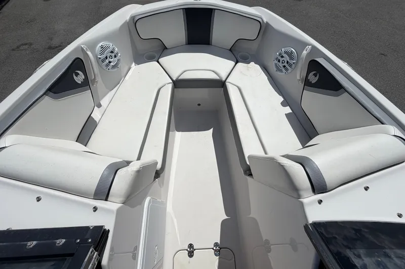 Slide: The Image of Interior of a 2018 Scarab 195 G boat with white seating and speakers. - 37