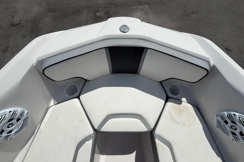 Slide: The Image of Interior of a 2018 Scarab 195 G boat with cushioned seating and speakers. - 40