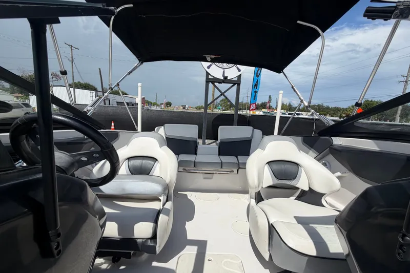 Slide: The Image of 2018 Scarab 195 G boat interior with modern seating and steering wheel. - 45