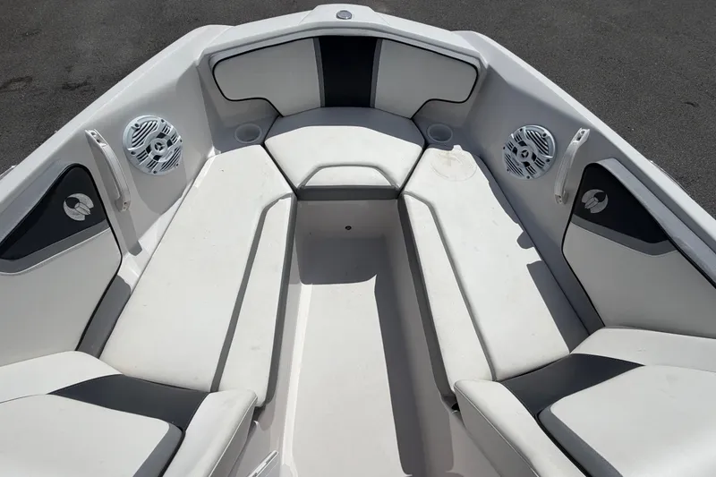 Slide: The Image of Interior of 2018 Scarab 195 G boat with white seating and speakers. - 38