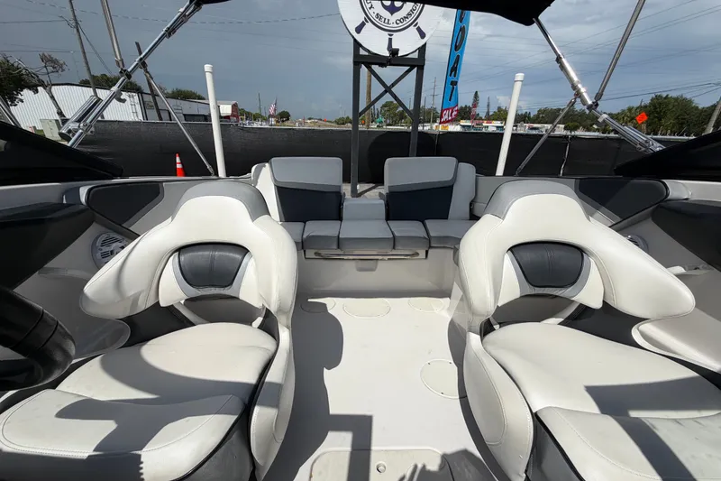 Slide: The Image of Interior of a 2018 Scarab 195 G boat with white seating and modern design. - 46
