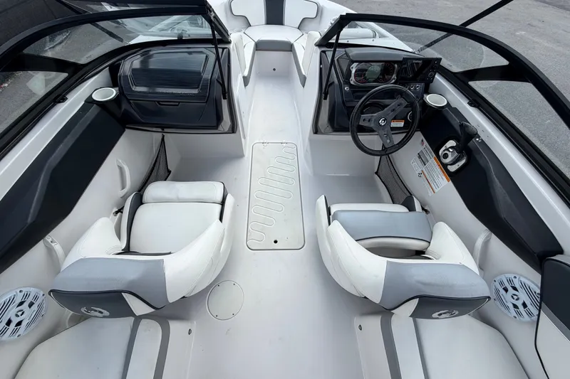 Slide: The Image of 2018 Scarab 195 G boat interior with dual seating and steering console. - 16