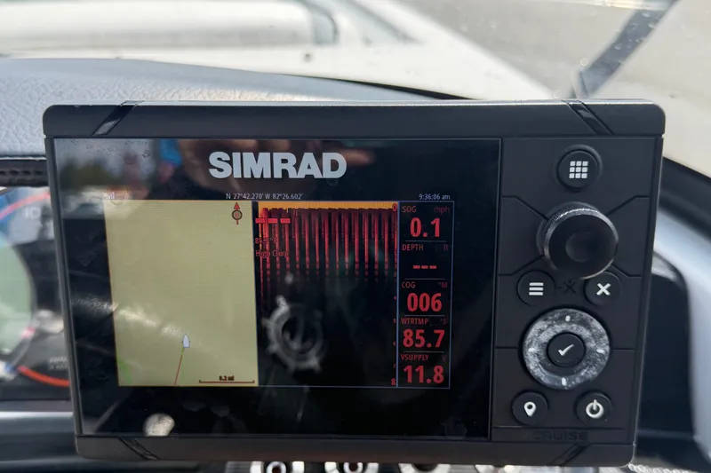 Slide: The Image of Simrad marine display on 2018 Scarab 195 G, showing navigation and sonar data. - 24