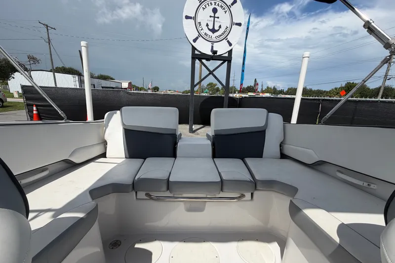Slide: The Image of 2018 Scarab 195 G boat interior with cushioned seating and nautical decor. - 48