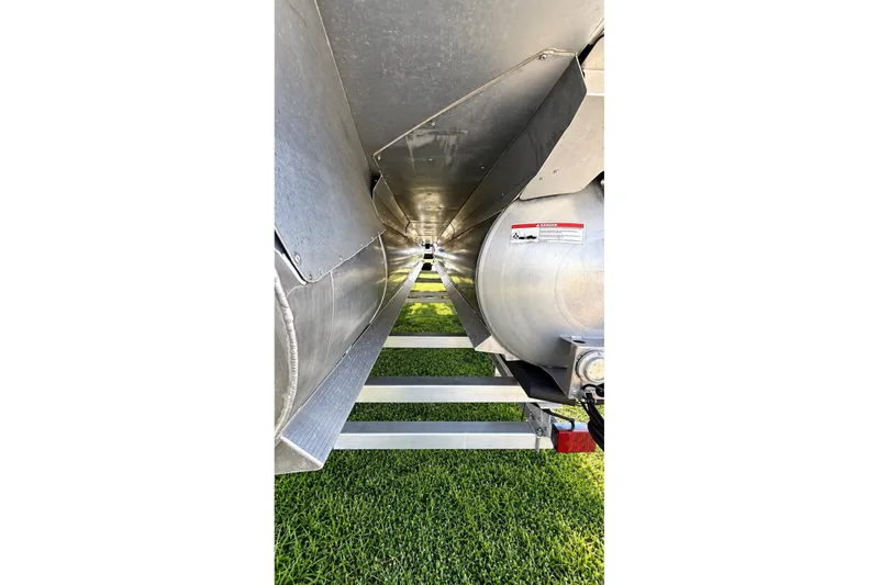 Slide: The Image of Underneath view of 2020 Barletta L-CLASS L25QCSSA pontoon boat on grass. - 44