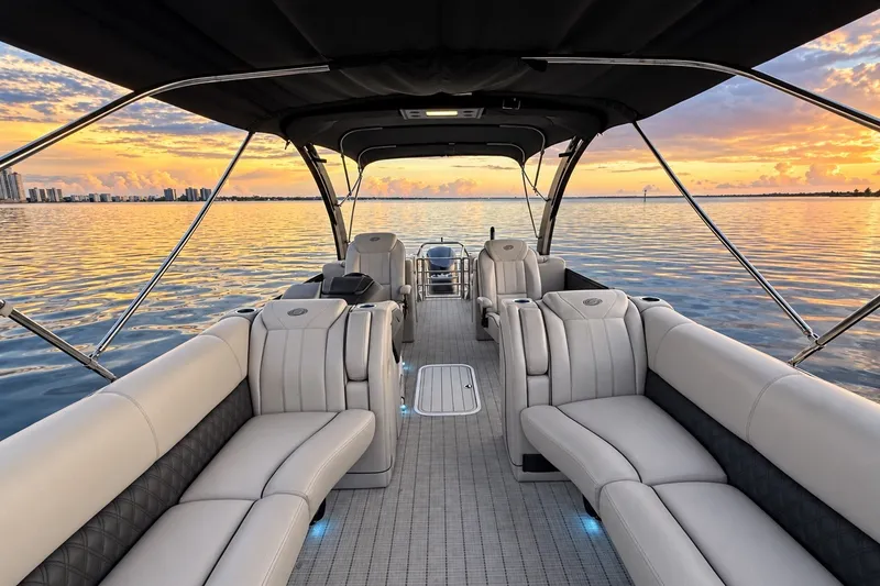 Slide: The Image of 2020 Barletta L-CLASS L25QCSSA boat interior with sunset view over calm water. - 27