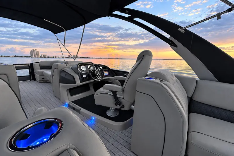 Slide: The Image of 2020 Barletta L-CLASS L25QCSSA boat interior with sunset view, featuring luxurious seating and modern design. - 31