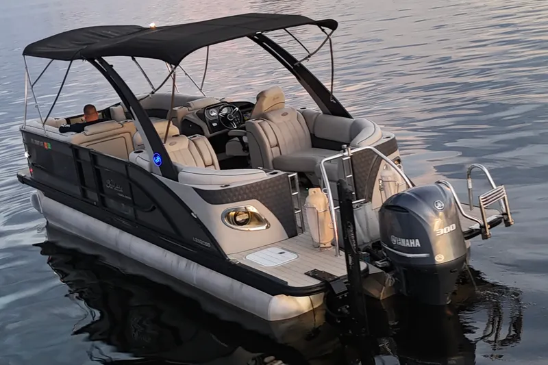 Slide: The Image of 2020 Barletta L-CLASS L25QCSSA pontoon boat with Yamaha 300 engine on calm water. - 17