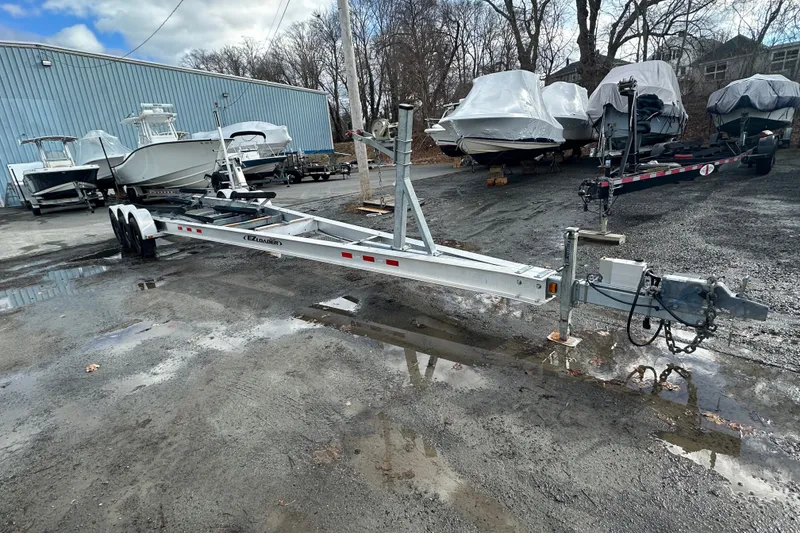 Slide: The Image of Boat trailer in a marina with covered boats, Grady-White Express 330, 2003 model. - 5