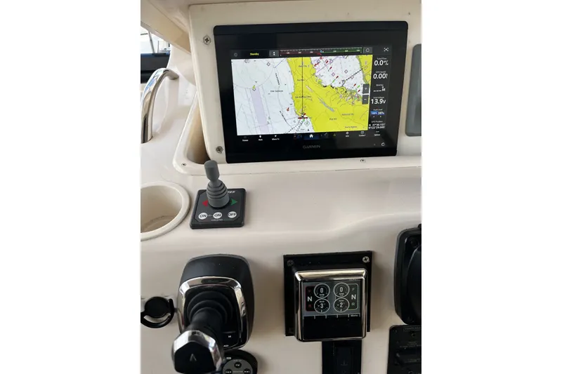 Slide: The Image of Dashboard of a 2003 Grady-White Express 330 with Garmin navigation display. - 7