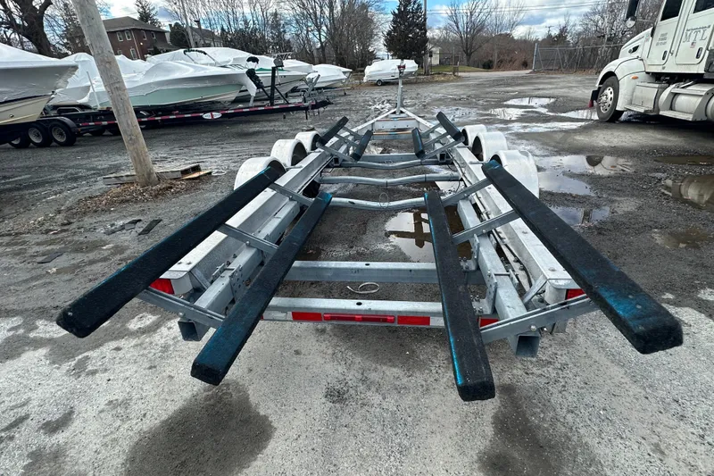 Slide: The Image of Boat trailer for 2003 Grady-White Express 330, parked in a lot with other boats. - 6