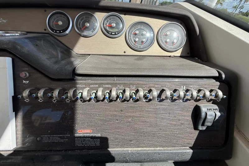 Slide: The Image of Control panel of a 2018 Sea Ray Sundancer 350 Coupe with gauges and switches. - 27