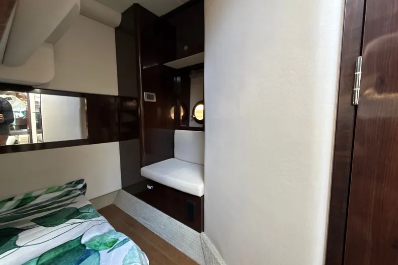 Slide: The Image of Interior of 2018 Sea Ray Sundancer 350 Coupe with modern wood and white decor. - 66
