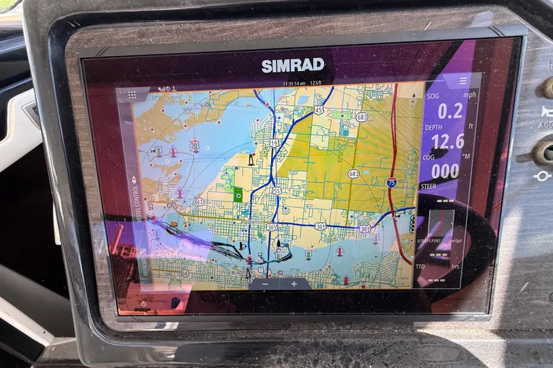 Slide: The Image of Simrad navigation display on 2018 Sea Ray Sundancer 350 Coupe, showing nautical map and vessel data. - 26