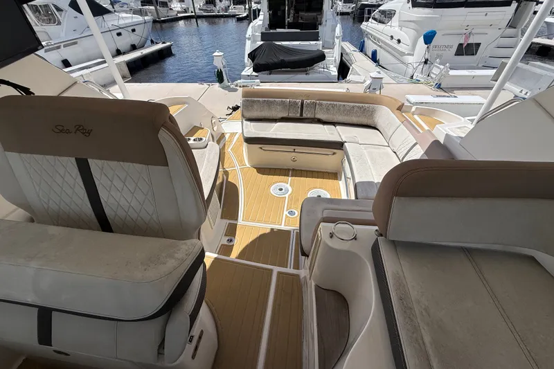 Slide: The Image of 2018 Sea Ray Sundancer 350 Coupe interior with plush seating and elegant design at marina. - 78