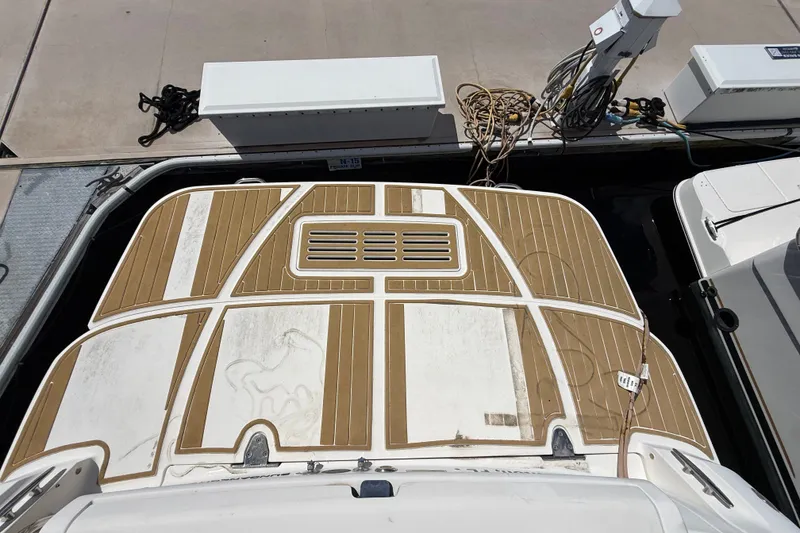Slide: The Image of 2018 Sea Ray Sundancer 350 Coupe docked, showcasing its spacious deck and modern design. - 96