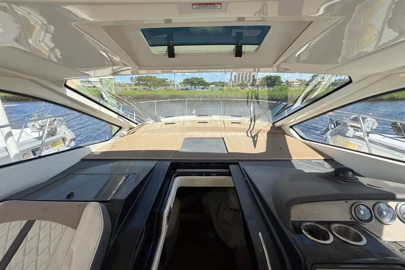 Slide: The Image of Interior view of 2018 Sea Ray Sundancer 350 Coupe yacht cockpit. - 29