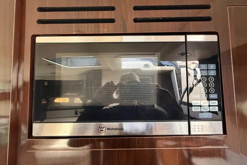 Slide: The Image of Built-in Westinghouse microwave in 2018 Sea Ray Sundancer 350 Coupe yacht kitchen. - 35