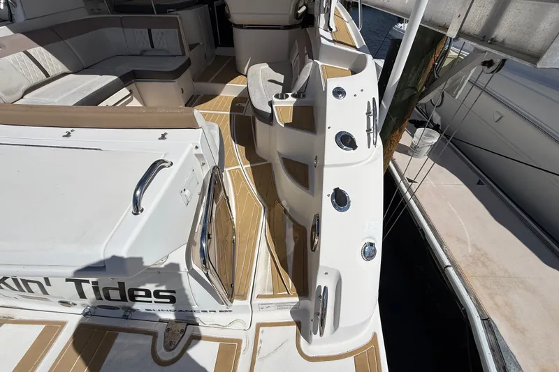 Slide: The Image of 2018 Sea Ray Sundancer 350 Coupe yacht deck with seating and dock view. - 15
