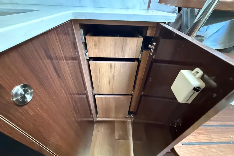 Slide: The Image of Wooden cabinet with drawers inside a 2018 Sea Ray Sundancer 350 Coupe yacht. - 40
