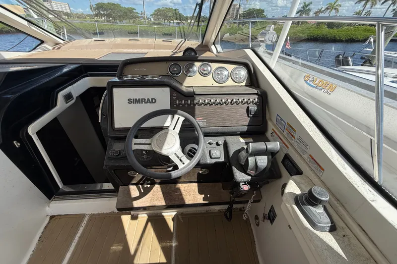 Slide: The Image of Cockpit of 2018 Sea Ray Sundancer 350 Coupe with Simrad navigation system. - 24