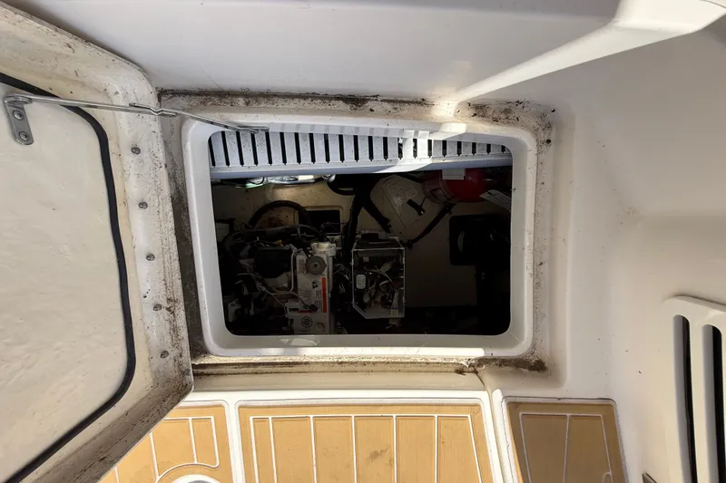 Slide: The Image of Engine compartment of a 2018 Sea Ray Sundancer 350 Coupe, viewed through an open hatch. - 91