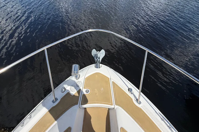 Slide: The Image of Bow view of 2018 Sea Ray Sundancer 350 Coupe on calm water. - 108