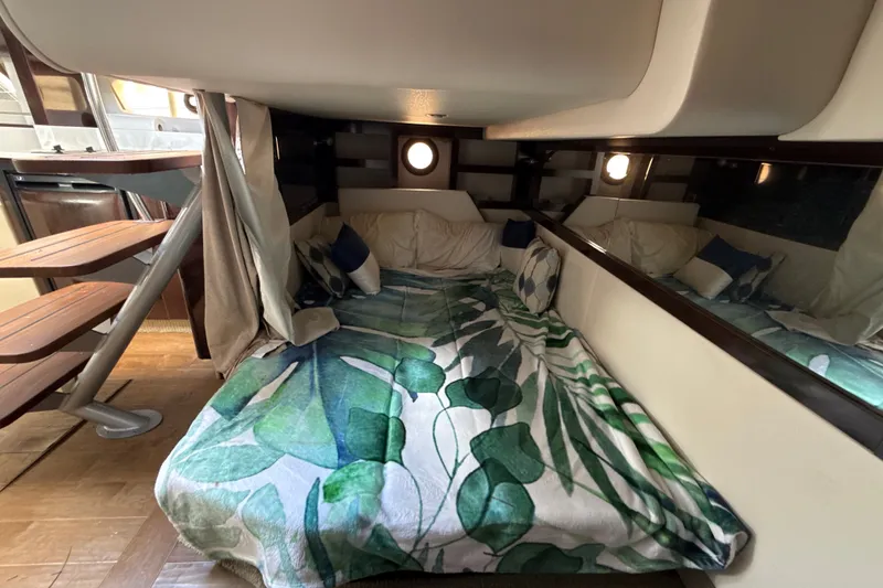 Slide: The Image of Interior cabin of 2018 Sea Ray Sundancer 350 Coupe with cozy bedding and modern design. - 67