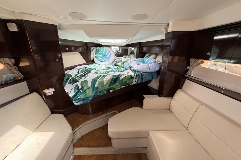 Slide: The Image of Luxurious interior of 2018 Sea Ray Sundancer 350 Coupe with cozy bed and seating. - 45