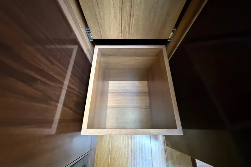 Slide: The Image of An empty wooden cabinet inside a 2018 Sea Ray Sundancer 350 Coupe. - 43