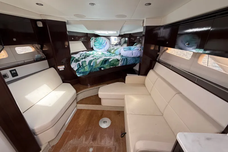 Slide: The Image of Luxurious interior of 2018 Sea Ray Sundancer 350 Coupe with cozy seating and bed. - 44