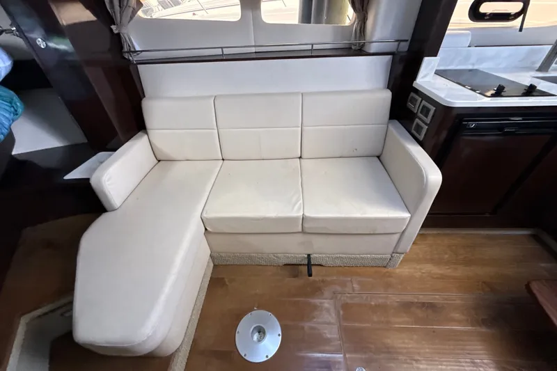 Slide: The Image of Interior of 2018 Sea Ray Sundancer 350 Coupe with white leather seating. - 47