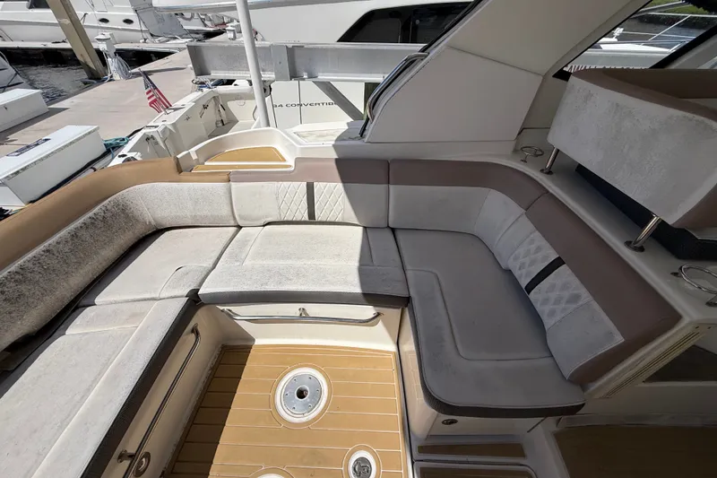 Slide: The Image of 2018 Sea Ray Sundancer 350 Coupe interior with plush seating and teak flooring. - 81