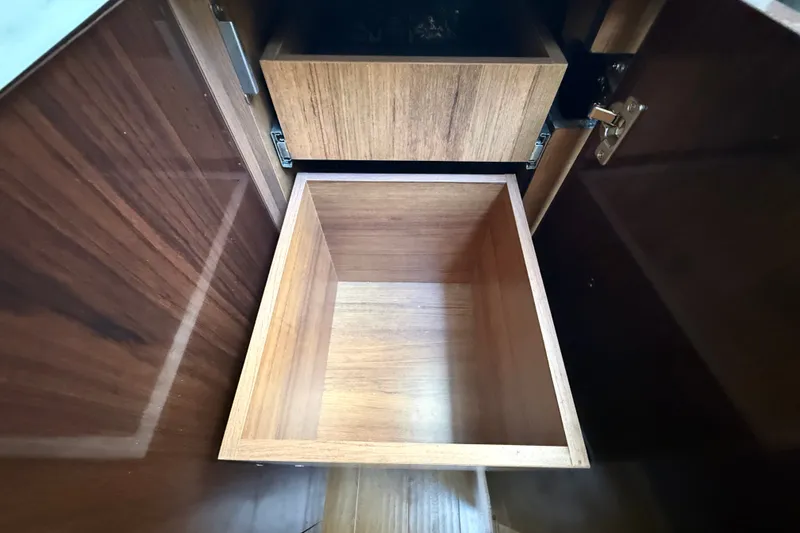 Slide: The Image of Wooden cabinet drawers inside a 2018 Sea Ray Sundancer 350 Coupe yacht. - 42