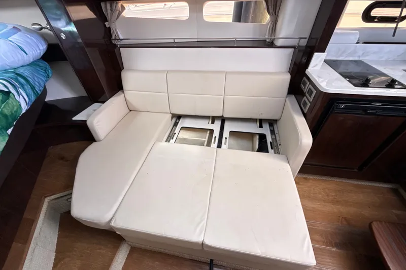 Slide: The Image of Interior of 2018 Sea Ray Sundancer 350 Coupe with convertible seating area. - 46