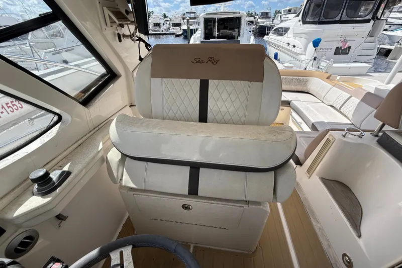 Slide: The Image of Interior of 2018 Sea Ray Sundancer 350 Coupe with luxurious seating and helm view. - 75
