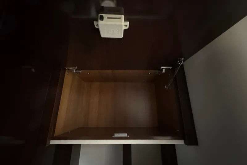 Slide: The Image of Empty wooden cabinet inside 2018 Sea Ray Sundancer 350 Coupe yacht. - 70