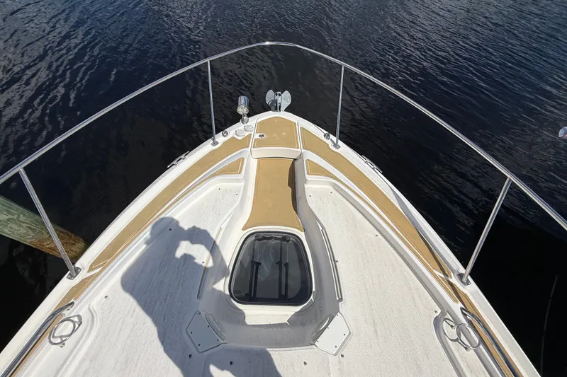 Slide: The Image of Bow view of 2018 Sea Ray Sundancer 350 Coupe on calm water. - 107