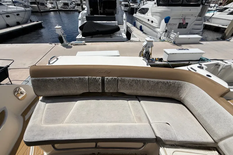 Slide: The Image of 2018 Sea Ray Sundancer 350 Coupe with spacious seating at marina dock. - 86