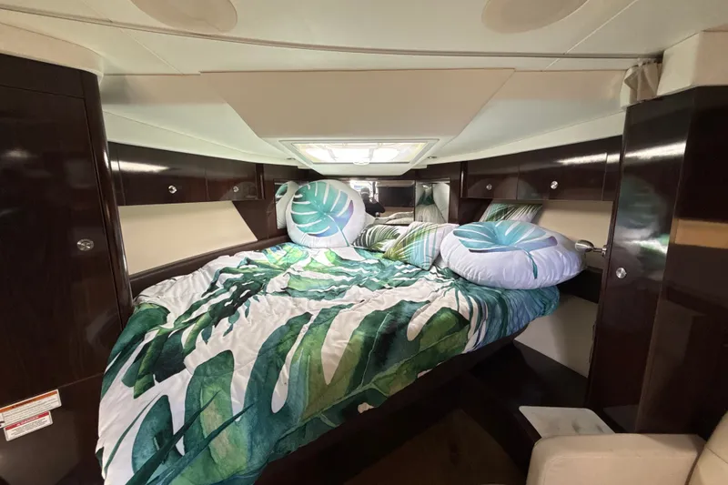 Slide: The Image of Luxurious cabin interior of 2018 Sea Ray Sundancer 350 Coupe with tropical bedding. - 52