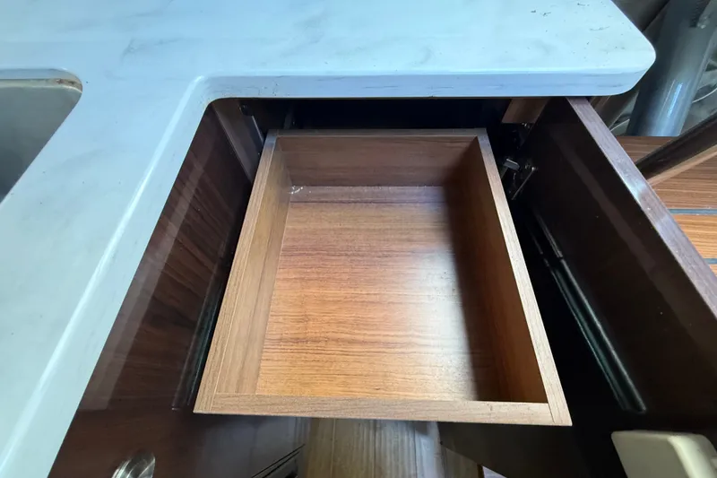 Slide: The Image of Open wooden drawer in 2018 Sea Ray Sundancer 350 Coupe kitchen area. - 41