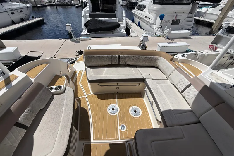 Slide: The Image of Spacious seating area on 2018 Sea Ray Sundancer 350 Coupe at marina. - 80