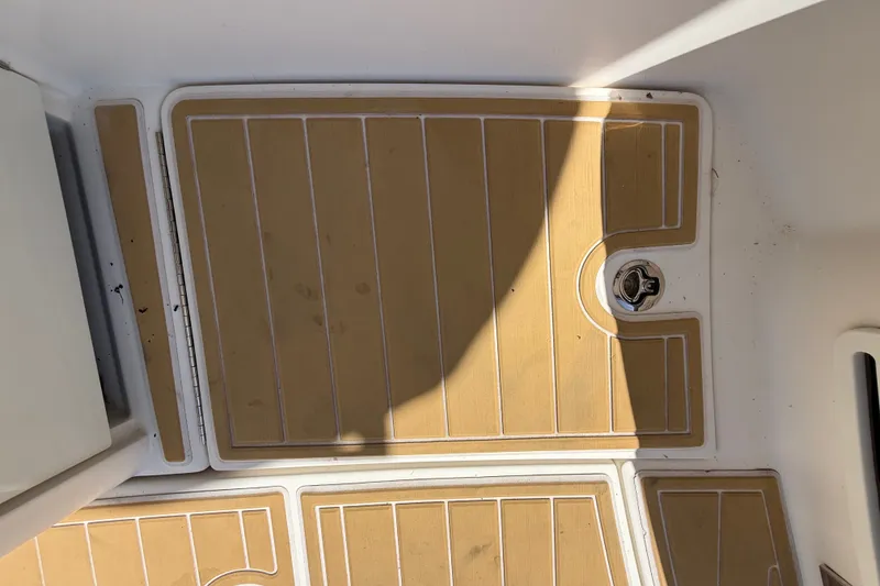 Slide: The Image of Teak-style deck flooring on 2018 Sea Ray Sundancer 350 Coupe boat. - 90