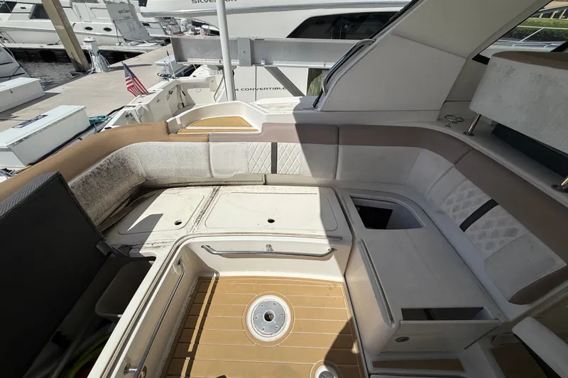 Slide: The Image of Interior view of a 2018 Sea Ray Sundancer 350 Coupe yacht with seating and storage. - 82