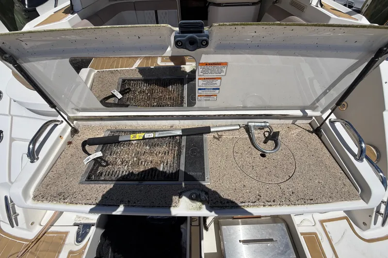 Slide: The Image of Open storage compartment on 2018 Sea Ray Sundancer 350 Coupe boat deck. - 124